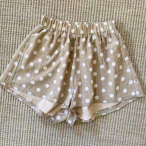 Tan polka dot shorts.